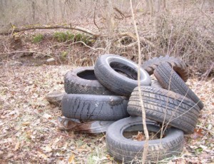 The last of the tires and vehicle gas tanks we cleaned up on our new property.